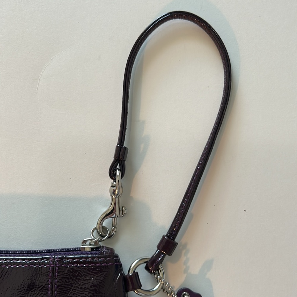 EUC Coach patent leather wristlet in dark purple or plum color and silver metal - Picture 7 of 10